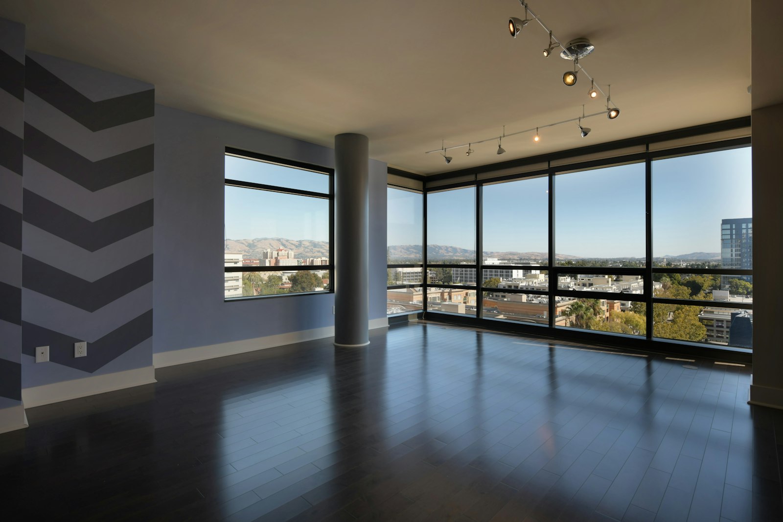 Floor-to-ceiling glass above the city